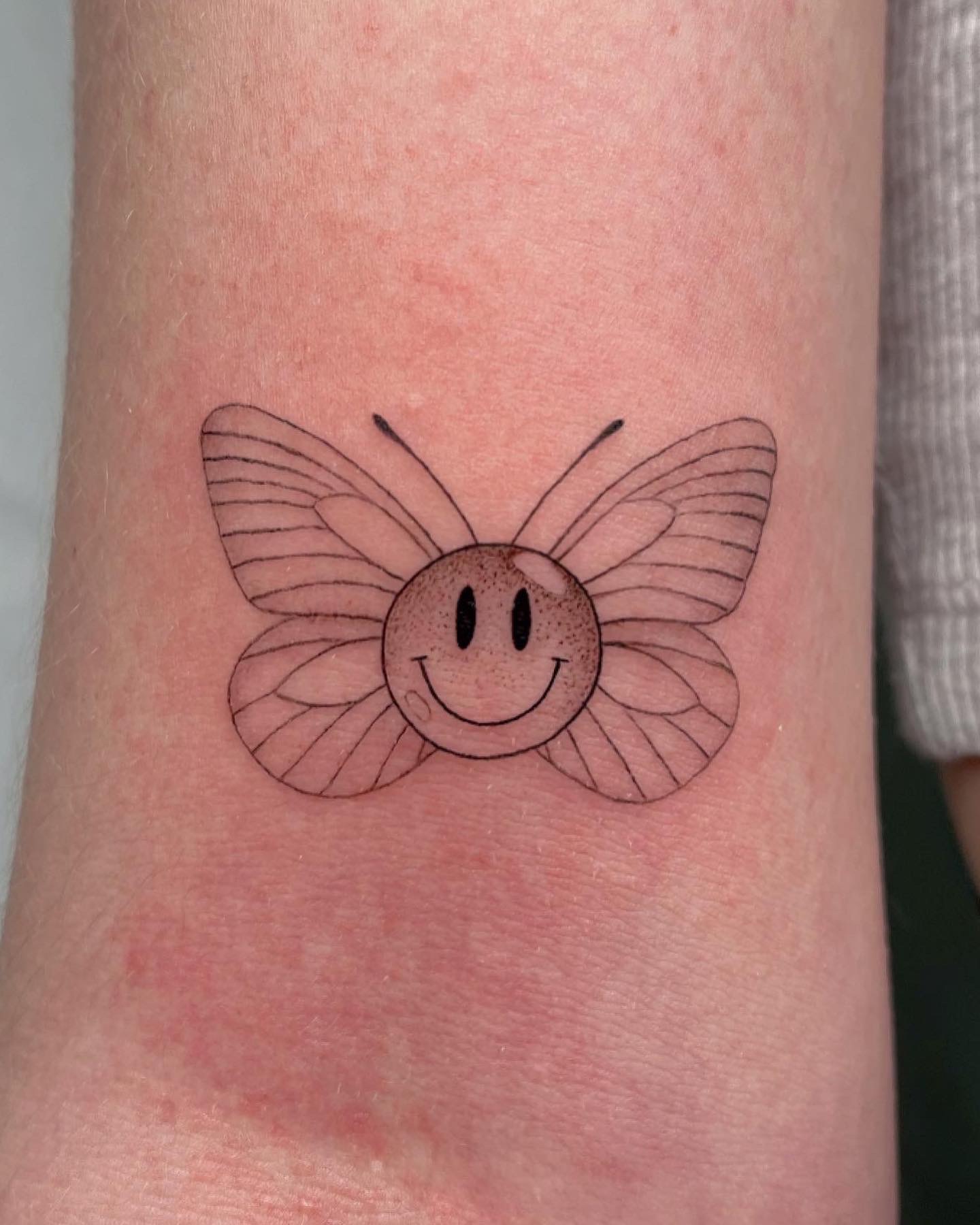 small fine line butterfly tattoo